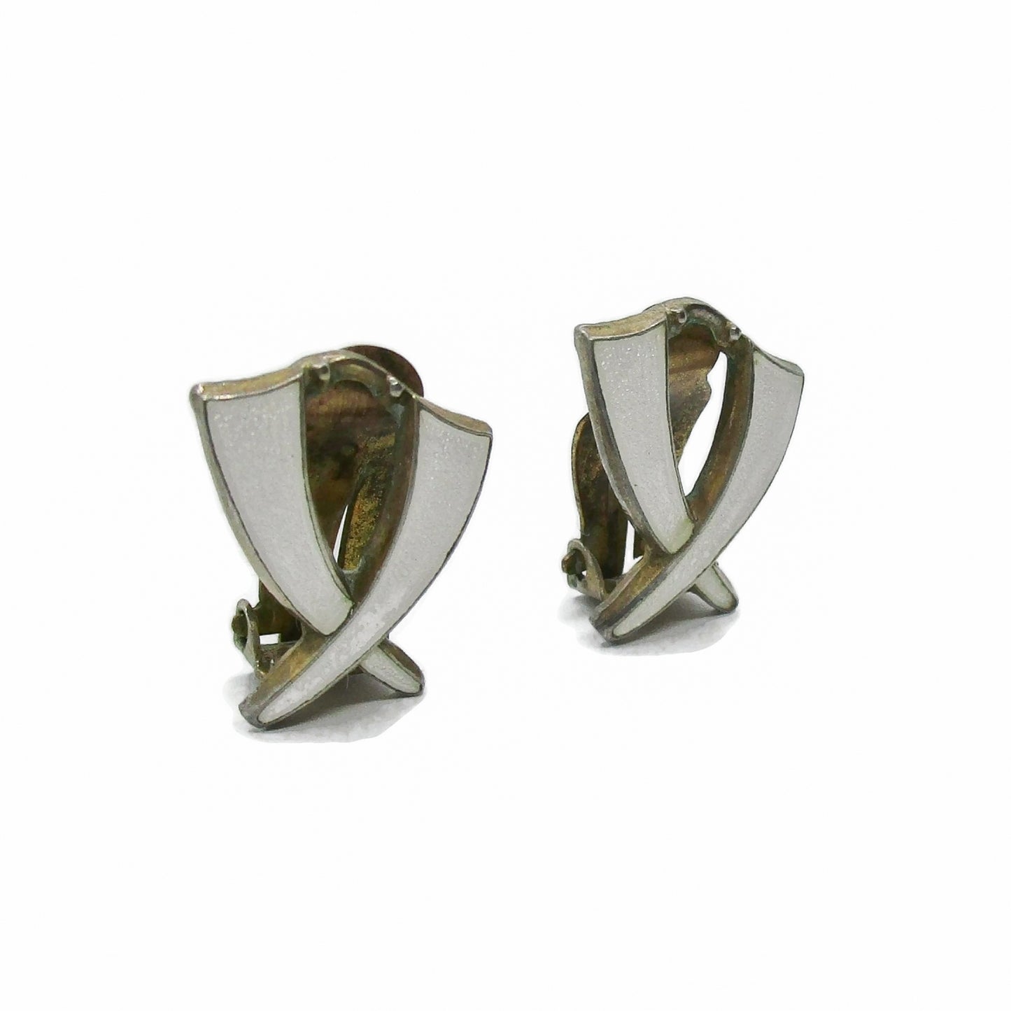 Angled view of a pair of Aksel Holmsen Norway sterling silver and enamel clip on earrings in a cross design