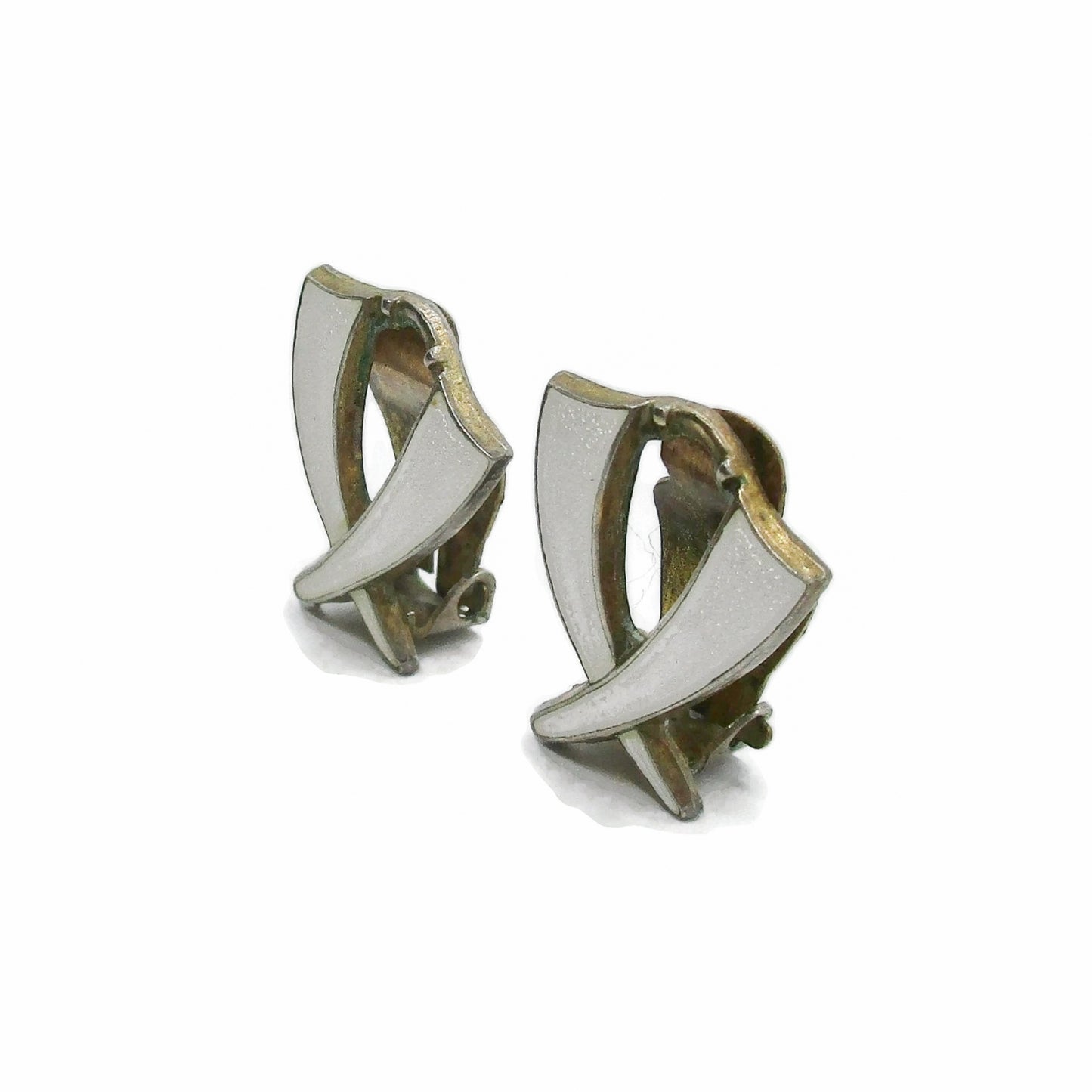 A pair of Aksel Holmsen Norway sterling silver and enamel clip on earrings in a cross design seen from the side
