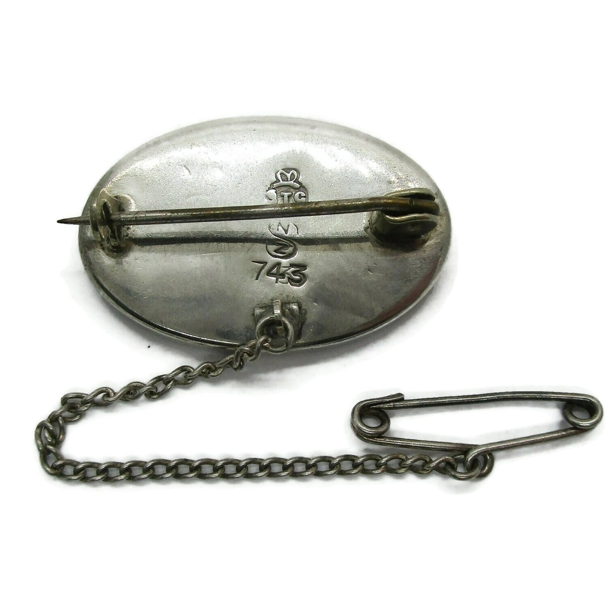 Oval sterling silver and paua shell brooch back view showing hallmarks