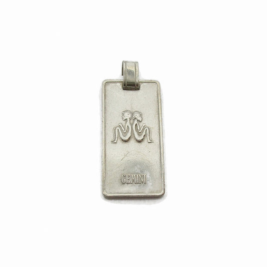 Front view of a rectangular silver Gemini pendant by Creola