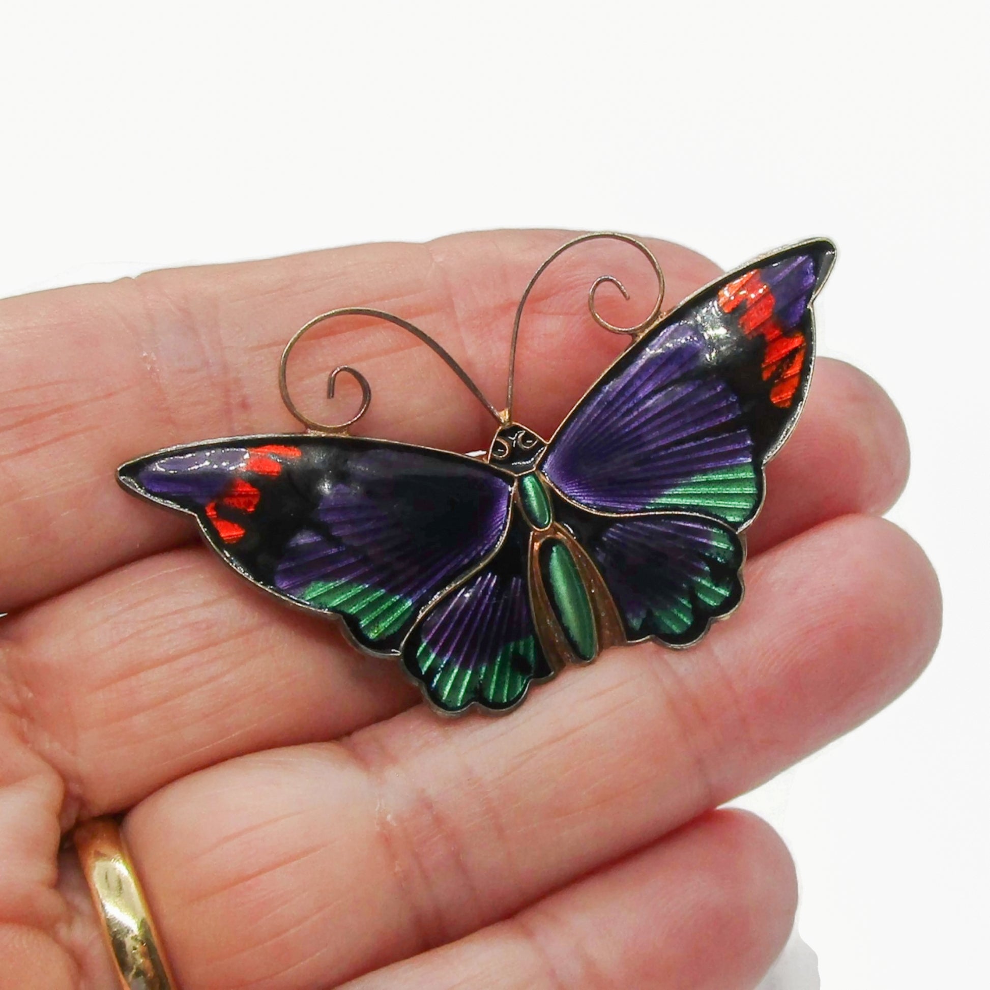 Large David Andersen Norway purple enamel and sterling silver gilt butterfly brooch shown held in a hand