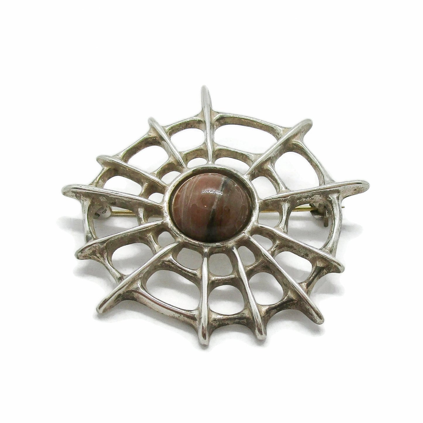 Close up view of David Andersen Norway sterling silver and thulite Troll series spiderweb brooch