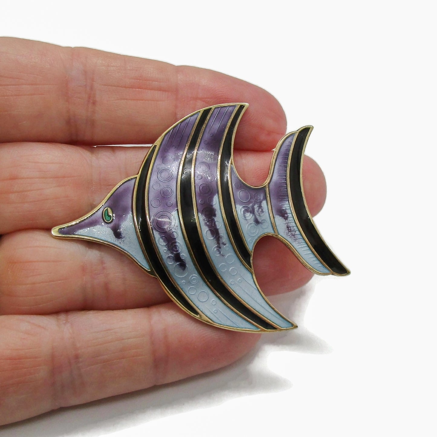 David Andersen sterling silver gilt and enamel angel fish brooch shown held in a hand