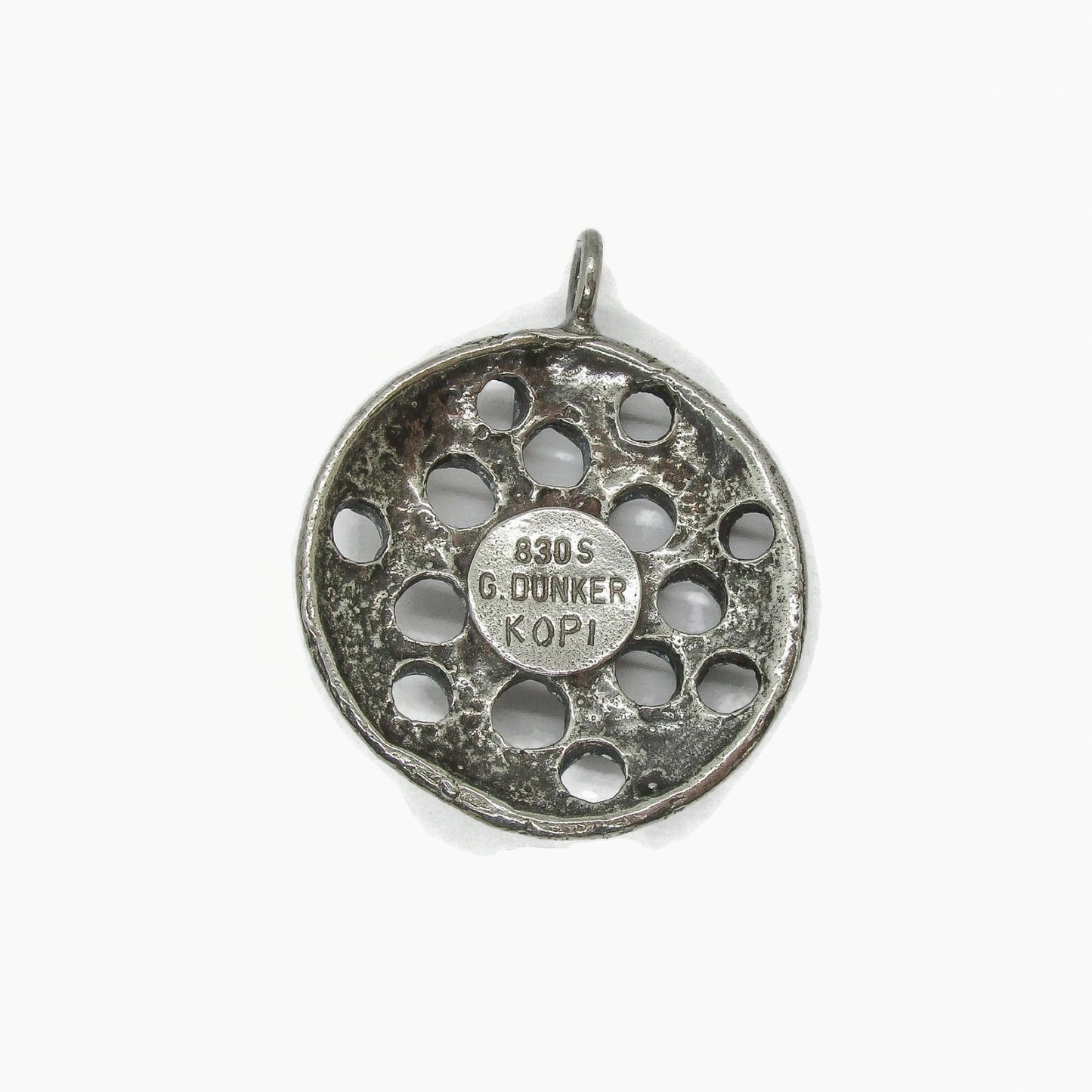 Back view of a silver Viking replica pendant by G Dunker Norway showing hallmarks