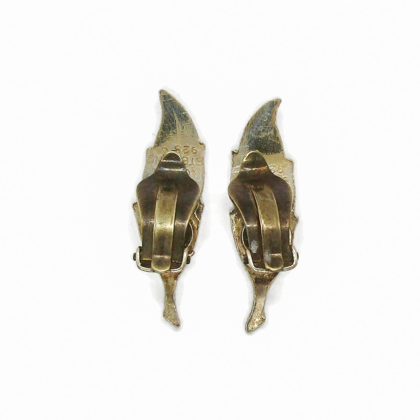 Back view of a pair of Finn Jensen Norway sterling silver gilt and white enamel leaf clip on earrings