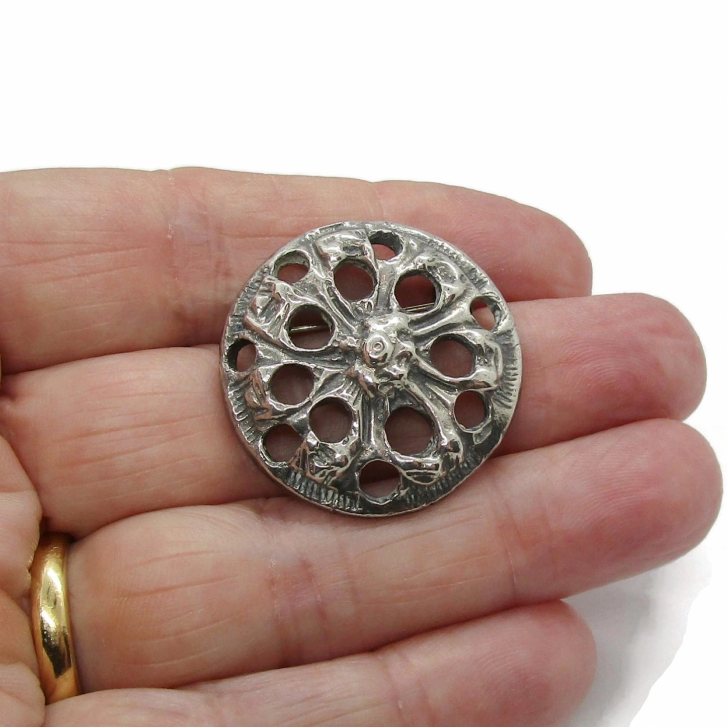 Gisbert Dunker Norway 830 silver viking brooch shown in a hand