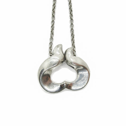 Close up view of a Georg Jensen sterling silver pendant of the year for 1995 designed by Allan Scharff