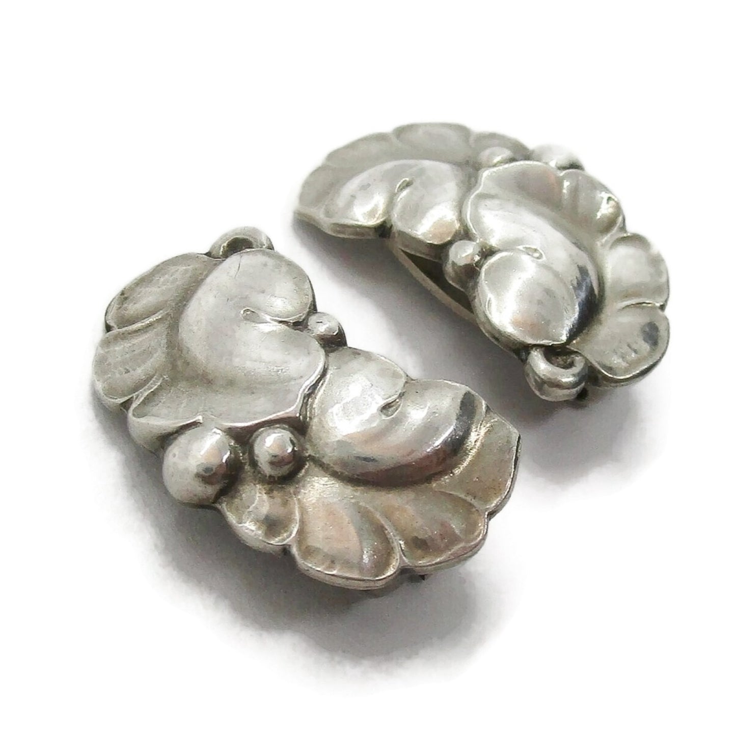 Angled view of a pair of Georg Jensen sterling silver clip on earrings design number 50A