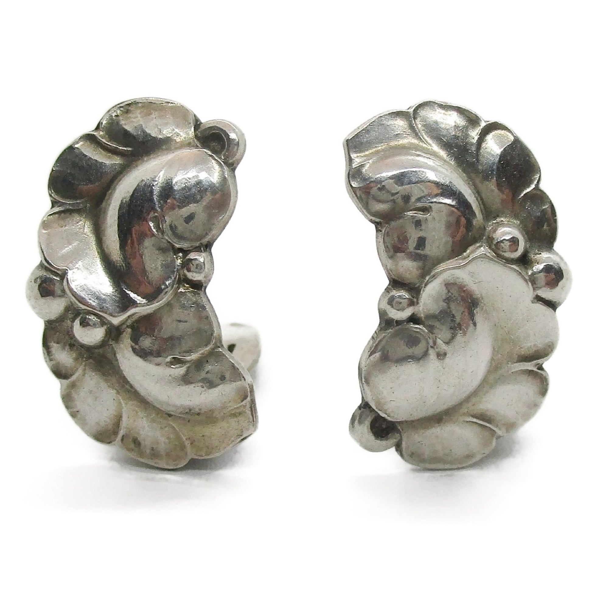 Close up view of a pair of Georg Jensen sterling silver clip on earrings design number 50A