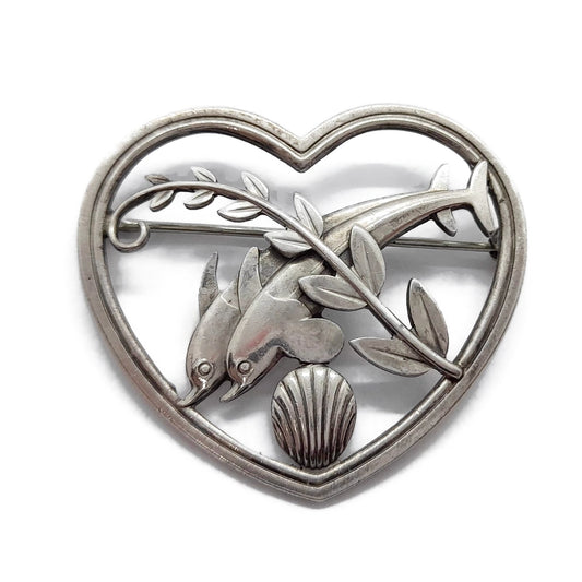 Front view of Georg Jensen sterling silver dolphins in a heart brooch number 312