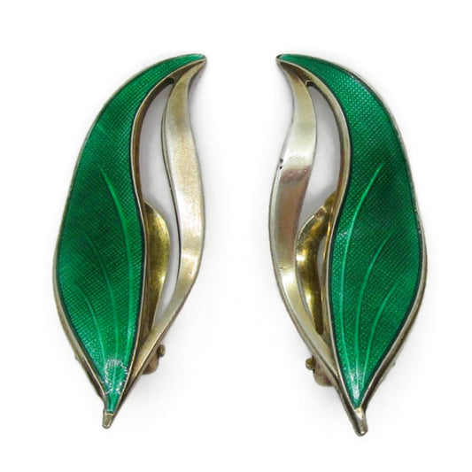 Front view of a pair of Hroar Prydz Norway green enamel and sterling silver gilt leaf shaped clip on earrings