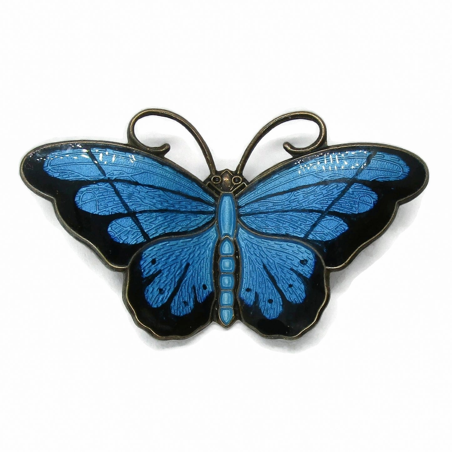 Front view of a Hroar Prydz blue enamel and sterling silver butterfly brooch