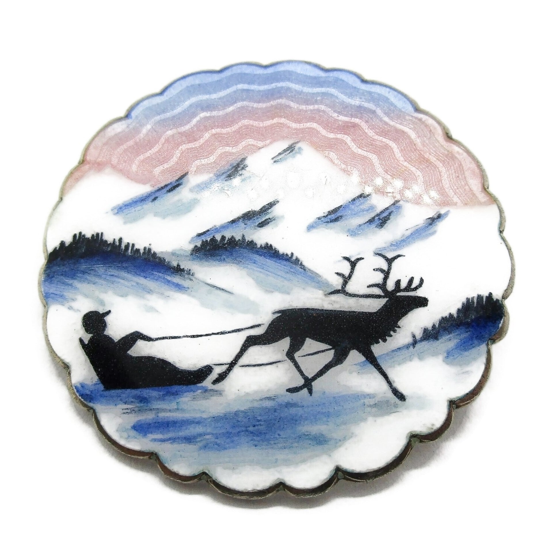 Large Ivar Holth sterling silver and enamel brooch showing man in sled pulled by reindeer front view