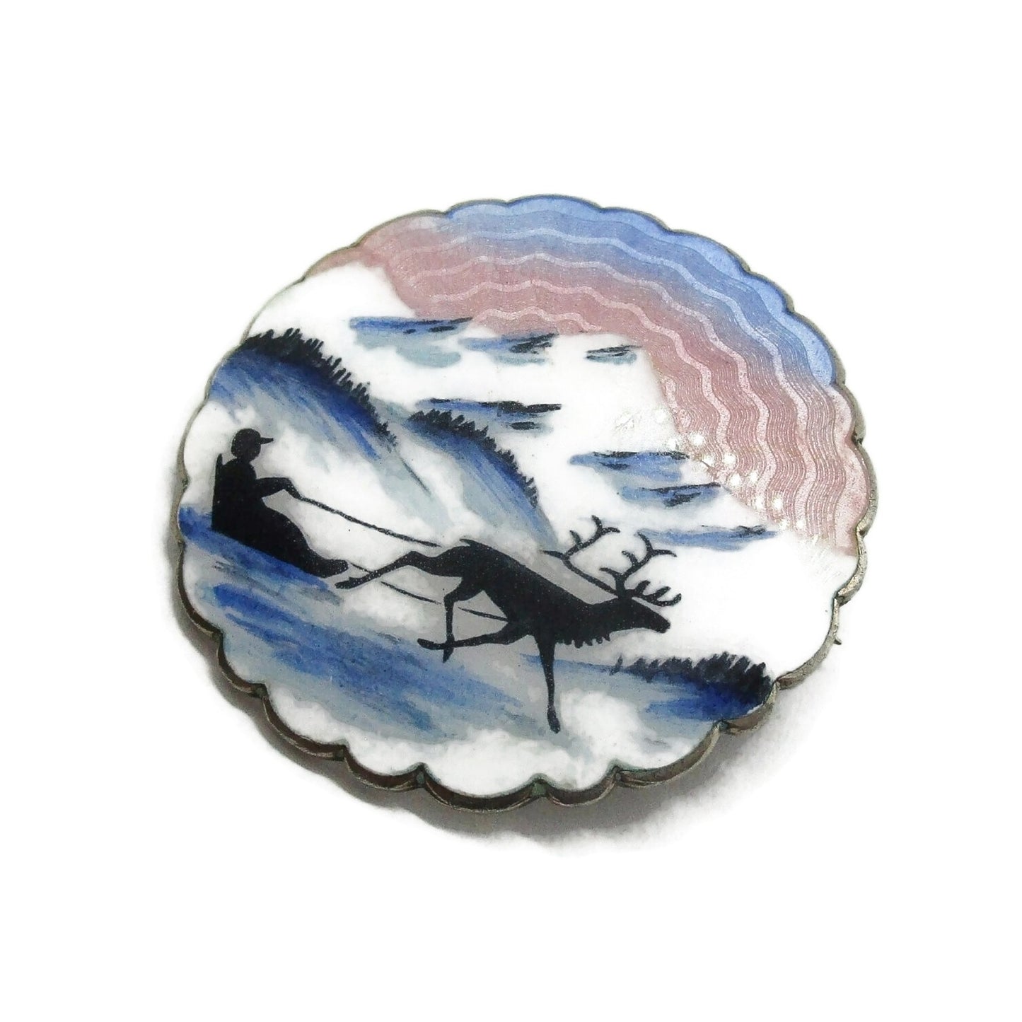Large Ivar Holth sterling silver and enamel brooch showing man in sled pulled by reindeer front view on right diagonal