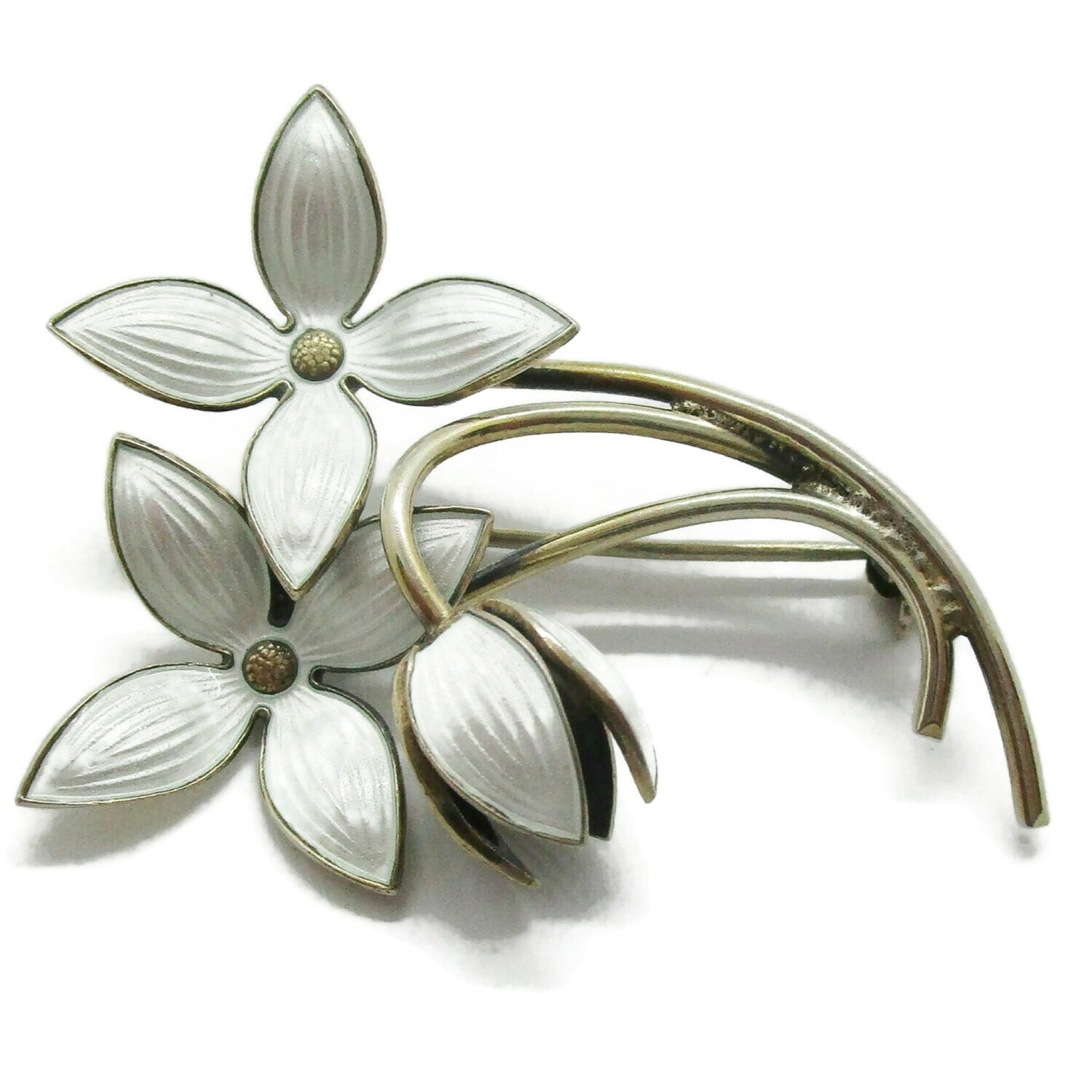Front view of an Ivar Holth Norway sterling silver gilt and white enamel flower spray brooch