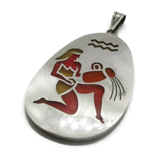 Front view of a big sterling silver Aquarius pendant by Janna Thomas Mexico