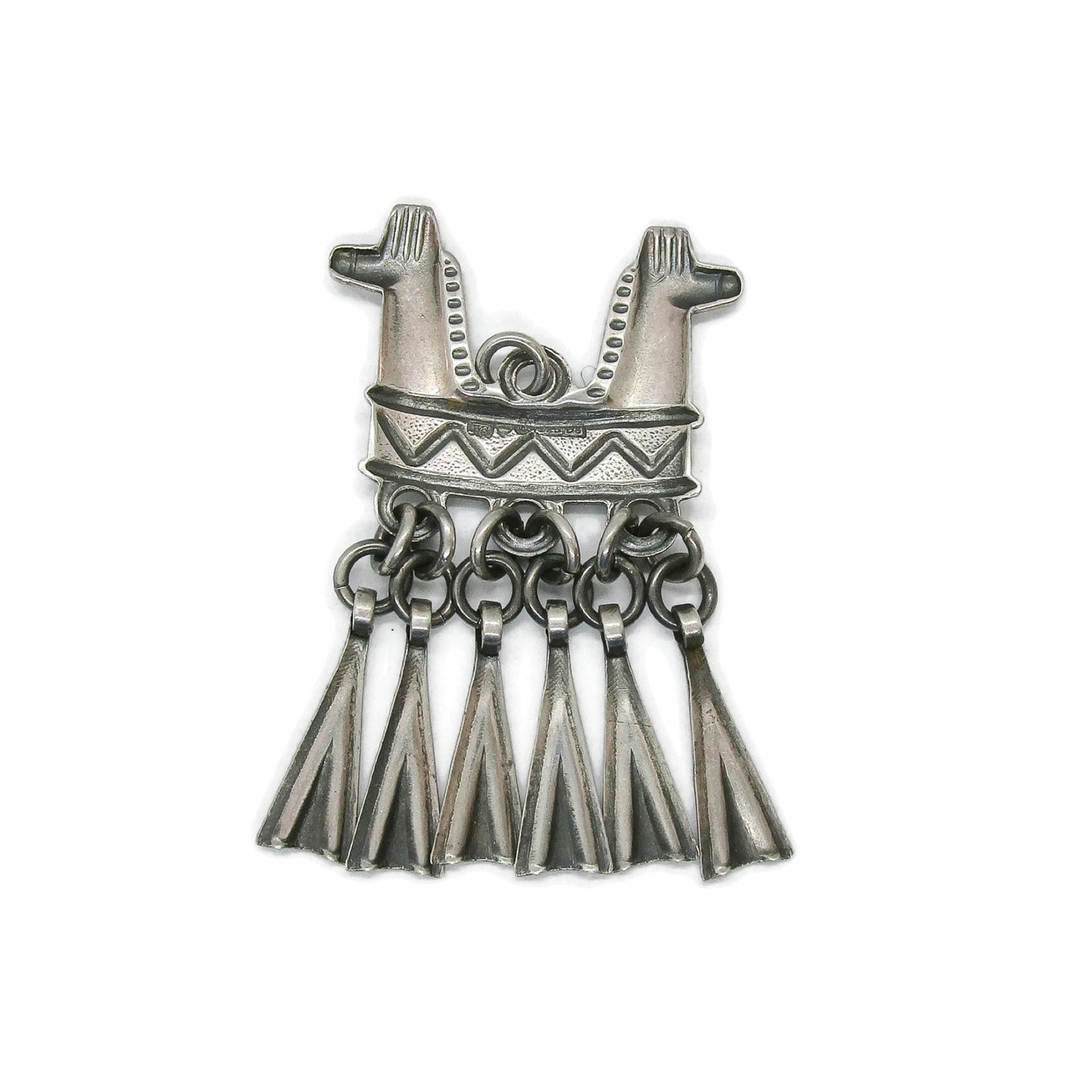 Back view of a Kalevala Koru Finland sterling silver double headed horse pendant