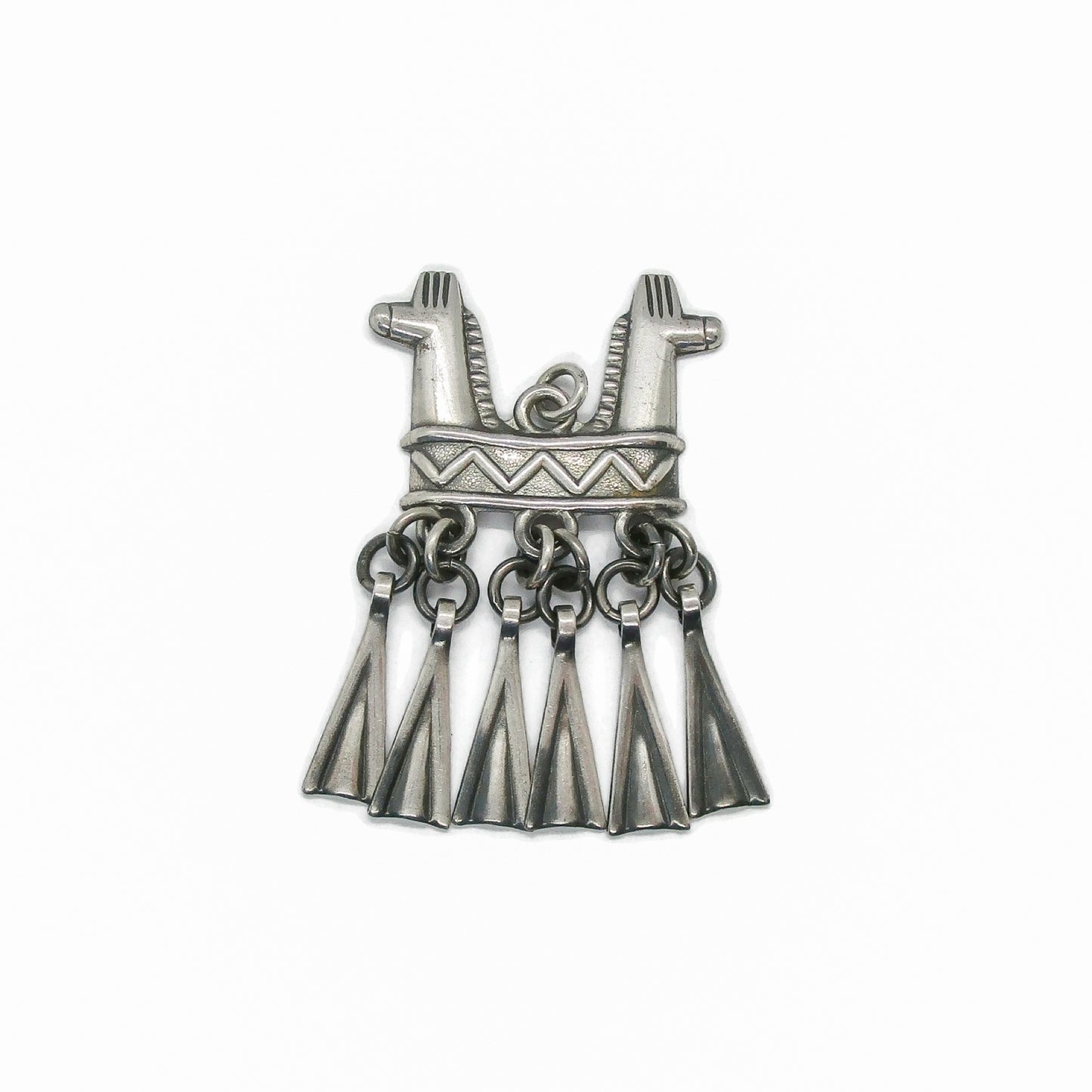 Front view of a Kalevala Koru Finland sterling silver double headed horse pendant