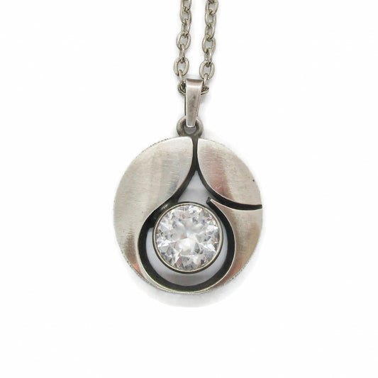 Front view of a Karl Laine Finn Feelings sterling silver and rock crystal pendant on a chain