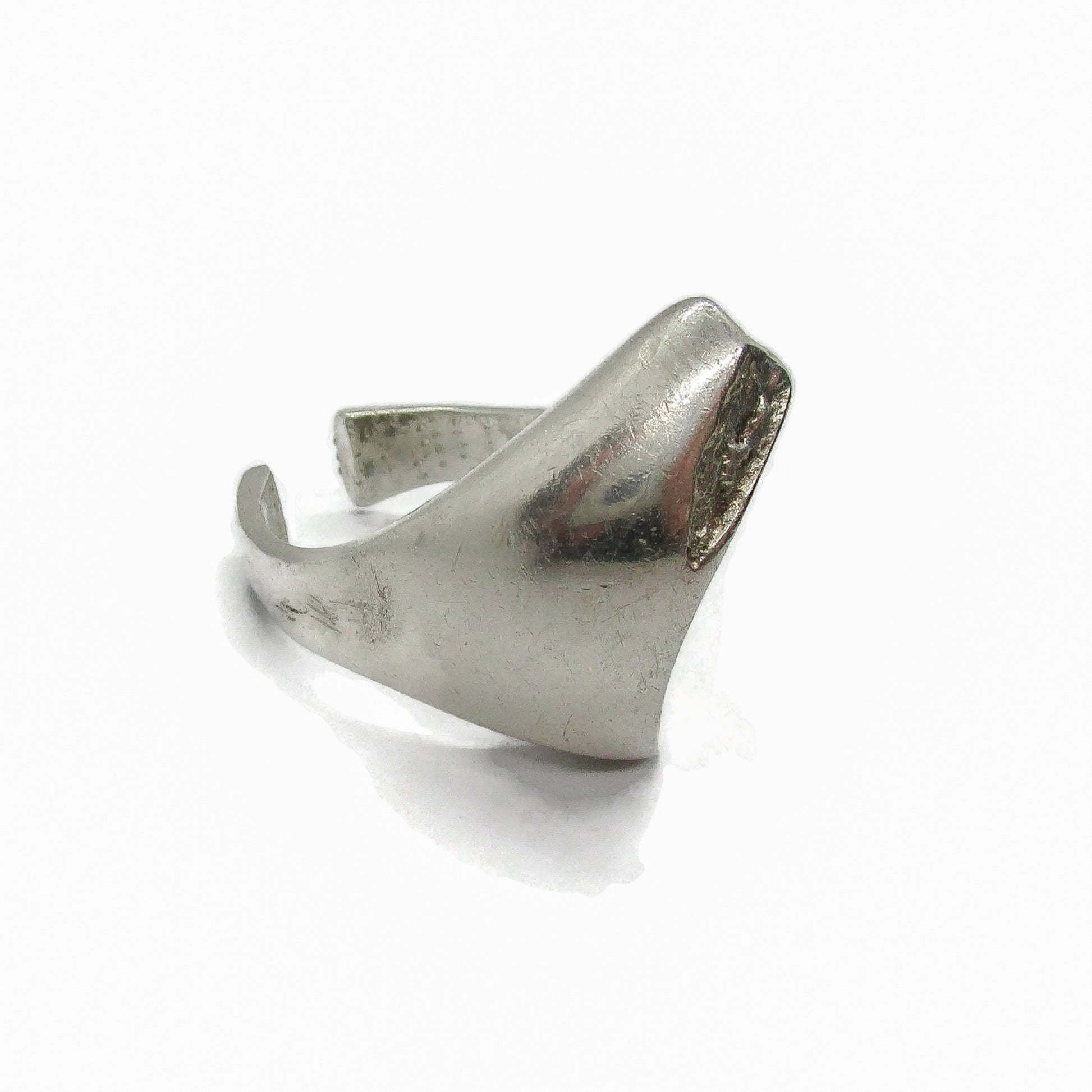 Side angled view of a Lapponia Finland sterling silver ring in the Balance design