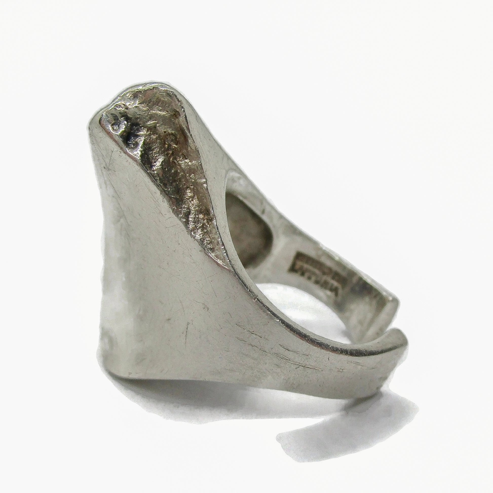 Side view of a Lapponia Finland sterling silver ring in the Balance design