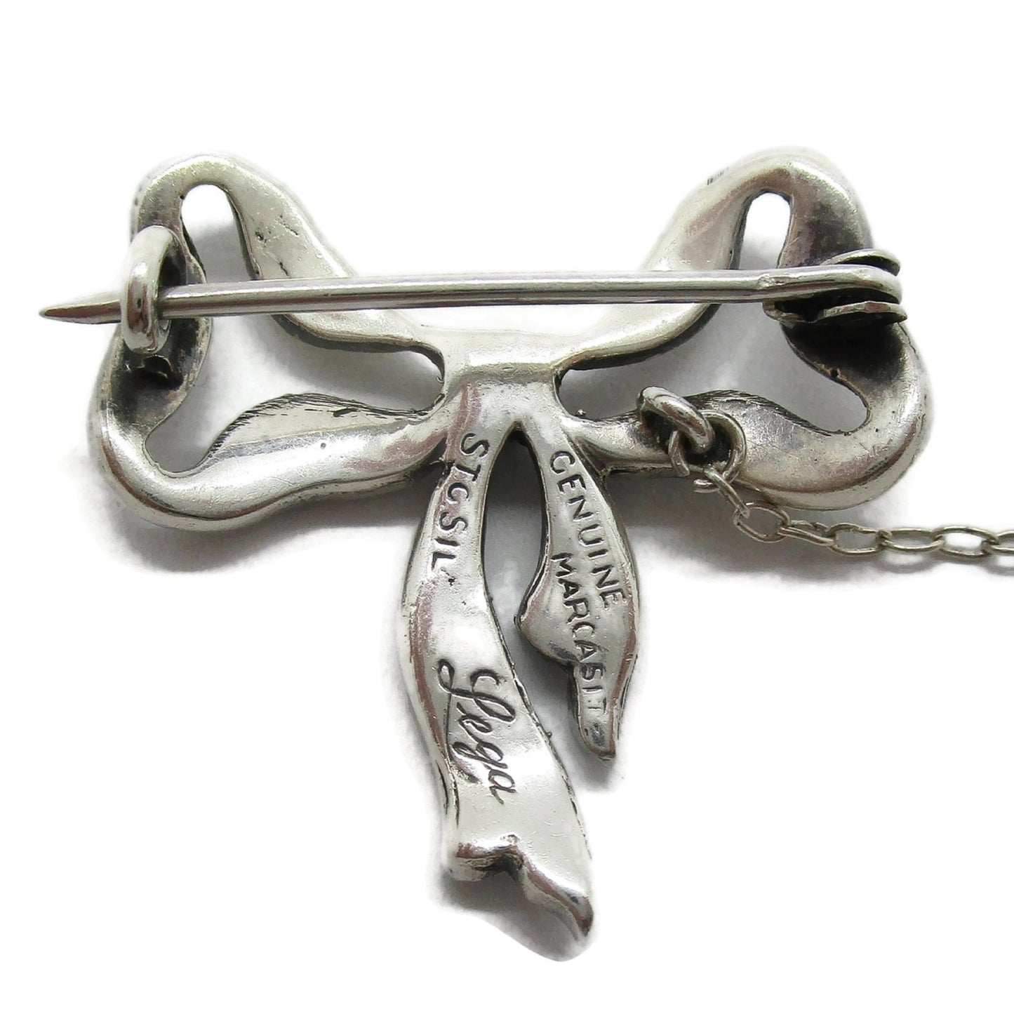 Backview of Lega Australia marcasite and sterling silver bow brooch showing hallmarks