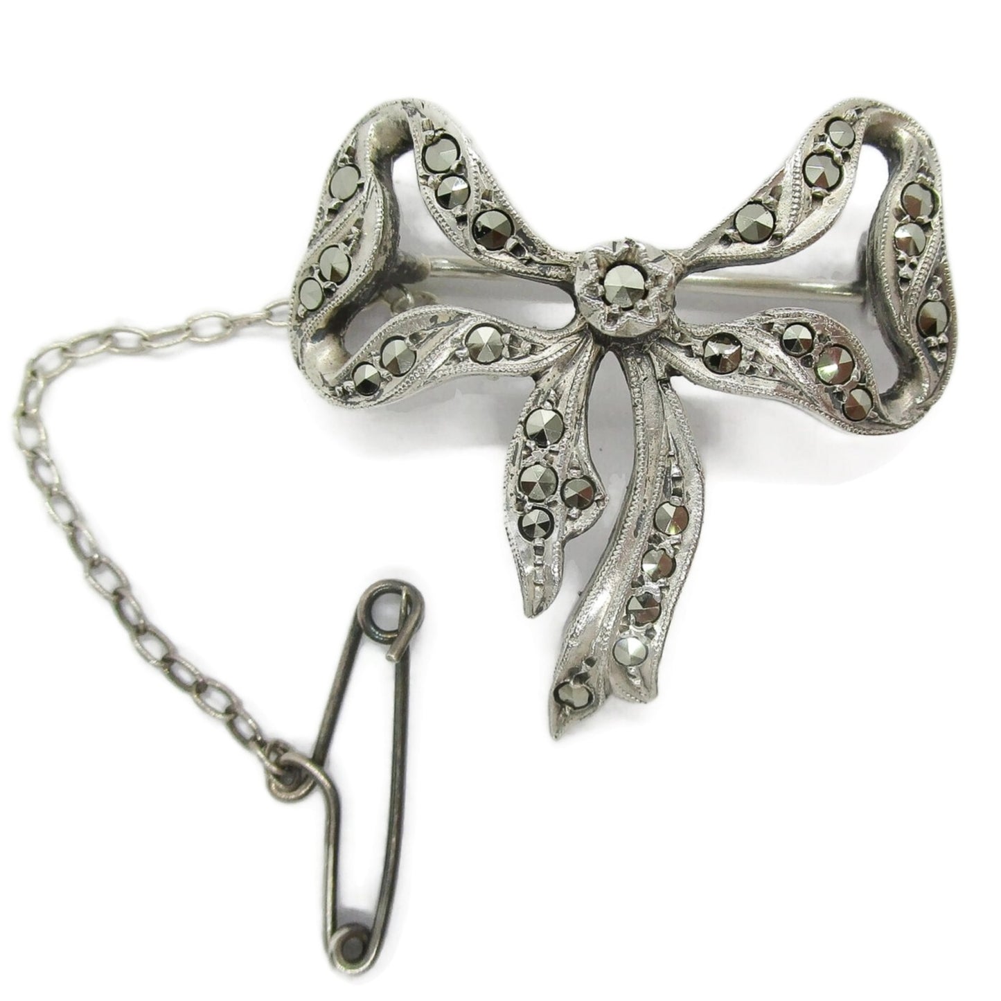Front view of Lega Australia sterling silver bow brooch with safety chain