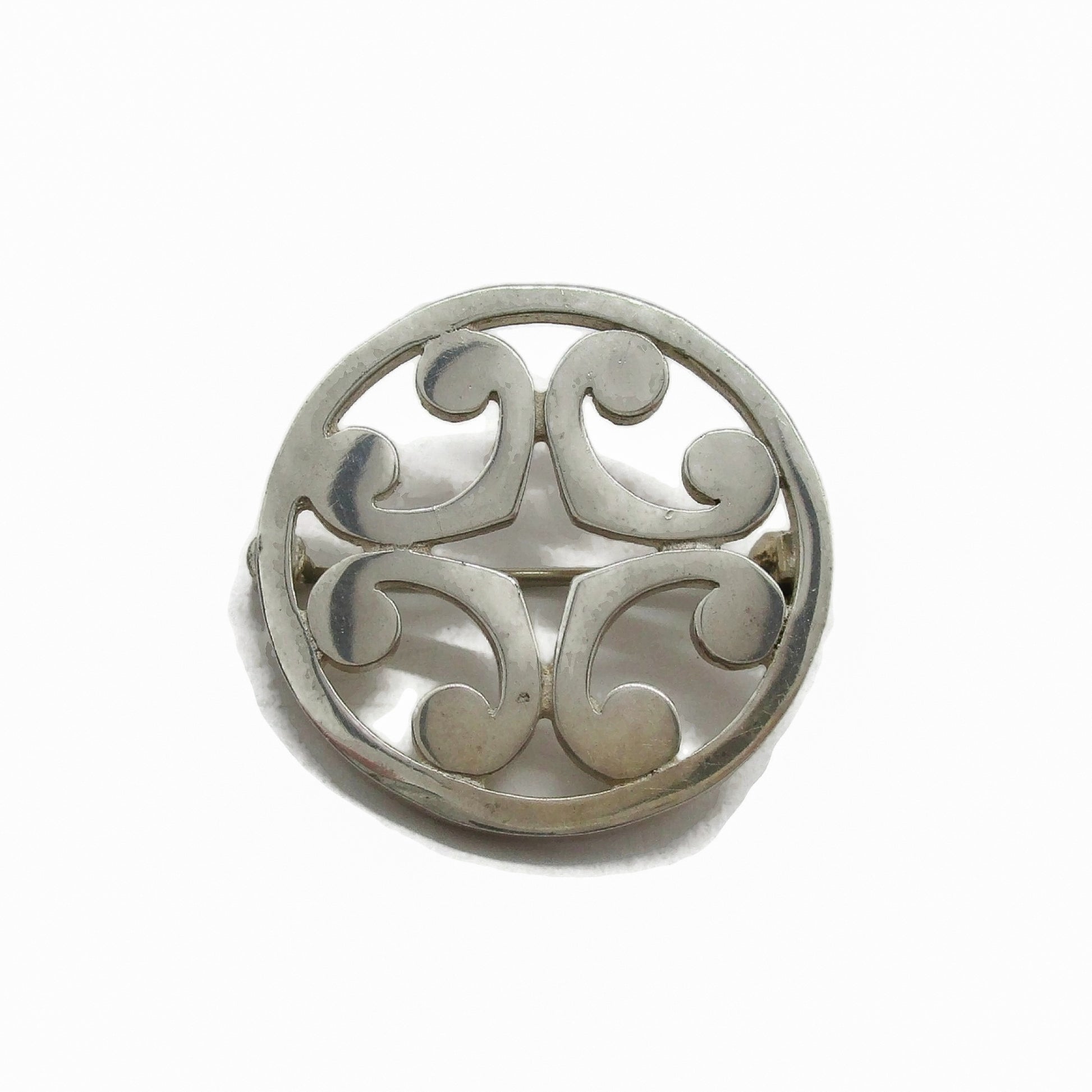 Close up of a Malcolm Gray sterling silver St Magnus brooch