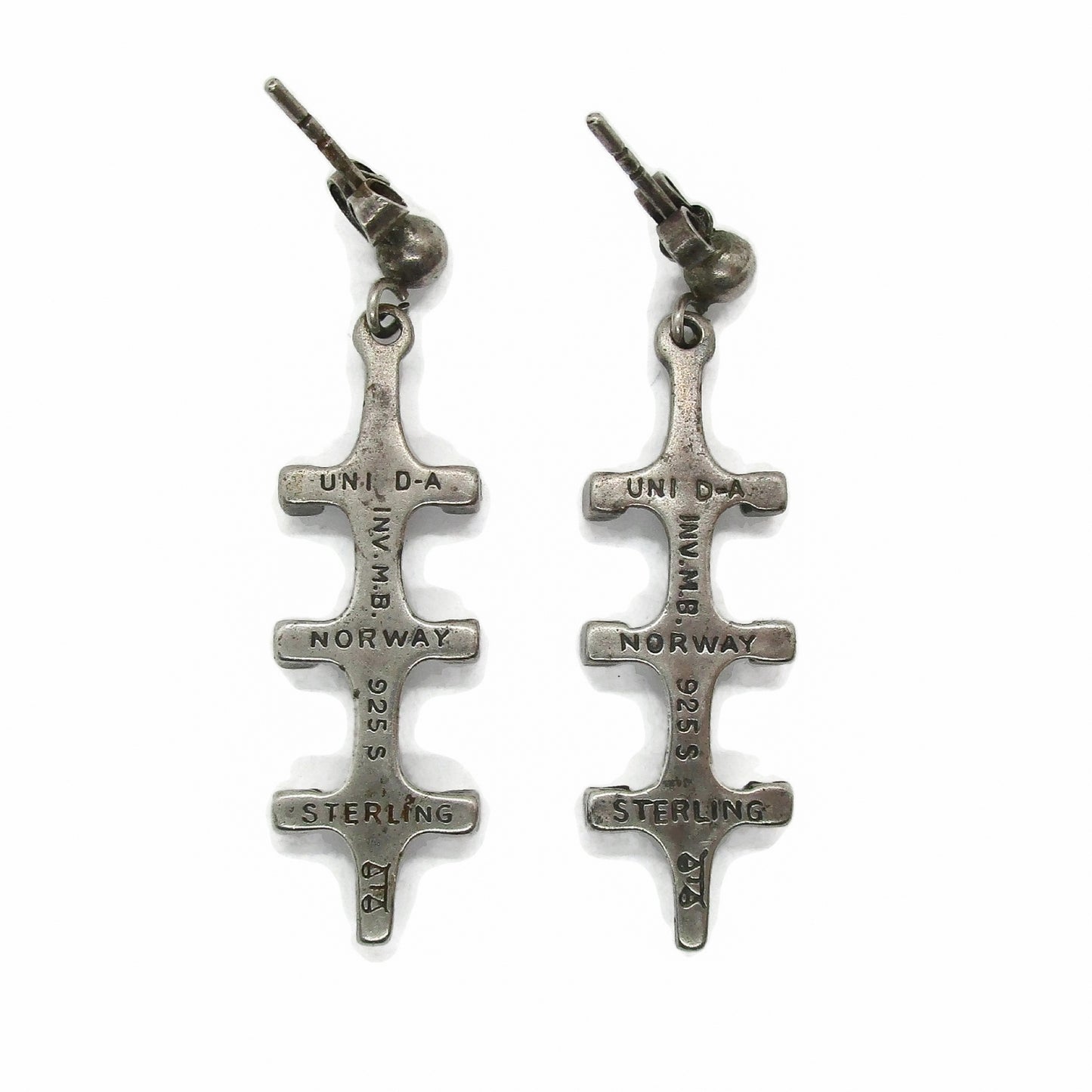 Back view of a pair of Marianne Berg Troll series sterling silver dangle earrings showing hallmarks