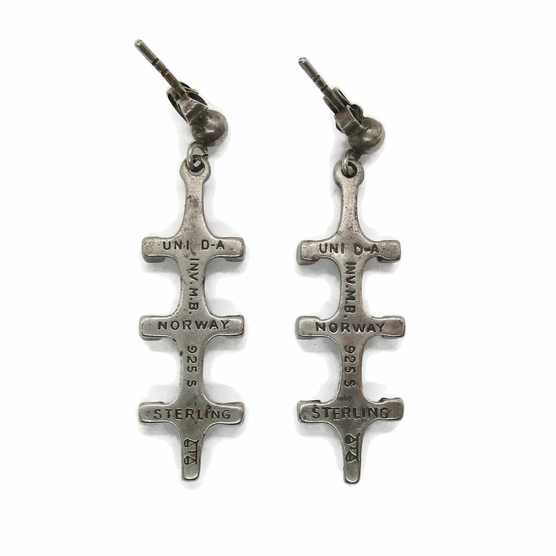 Back view of a pair of Marianne Berg Troll series sterling silver dangle earrings showing hallmarks