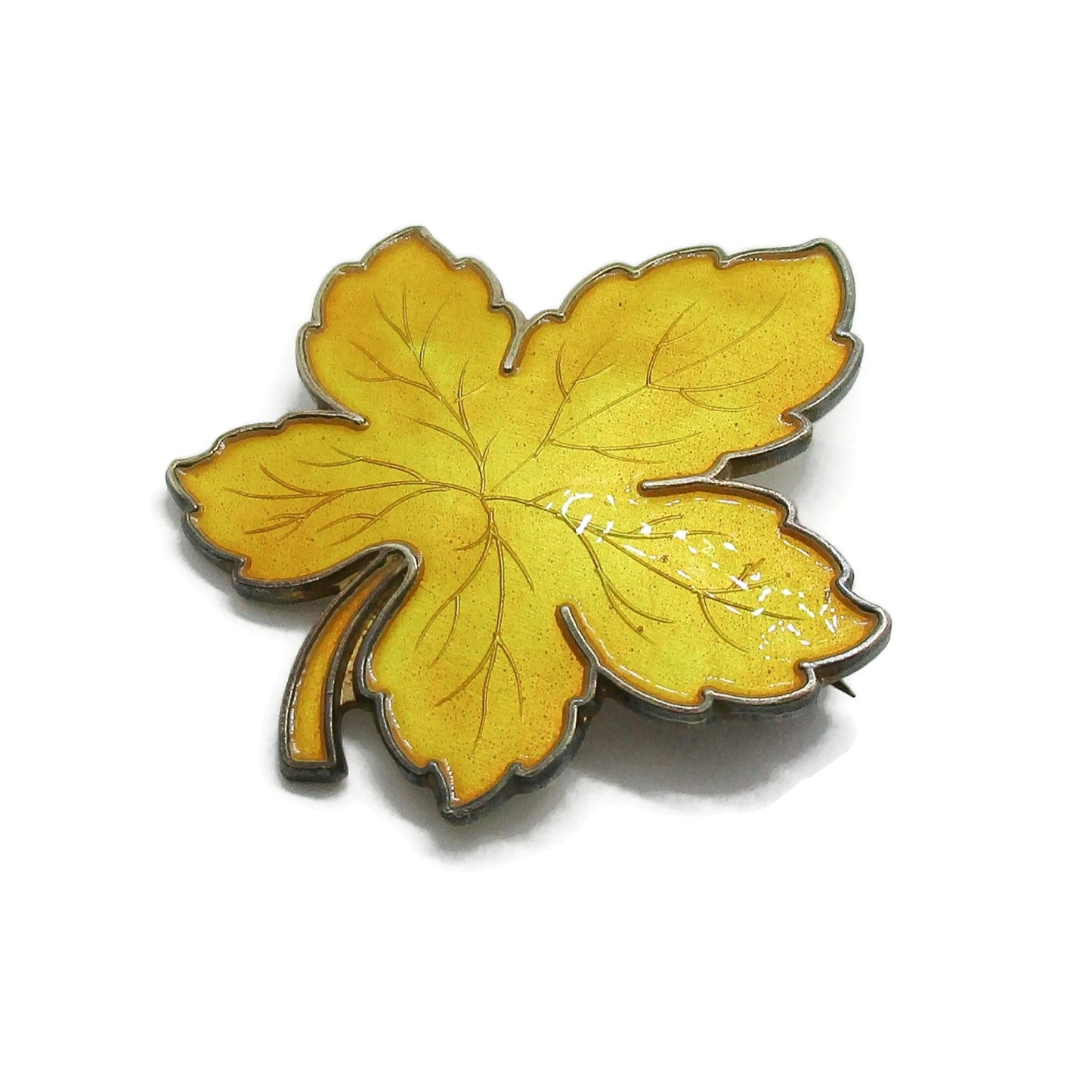 Meka Denmark sterling silver and yellow enamel maple leaf brooch seen from the side