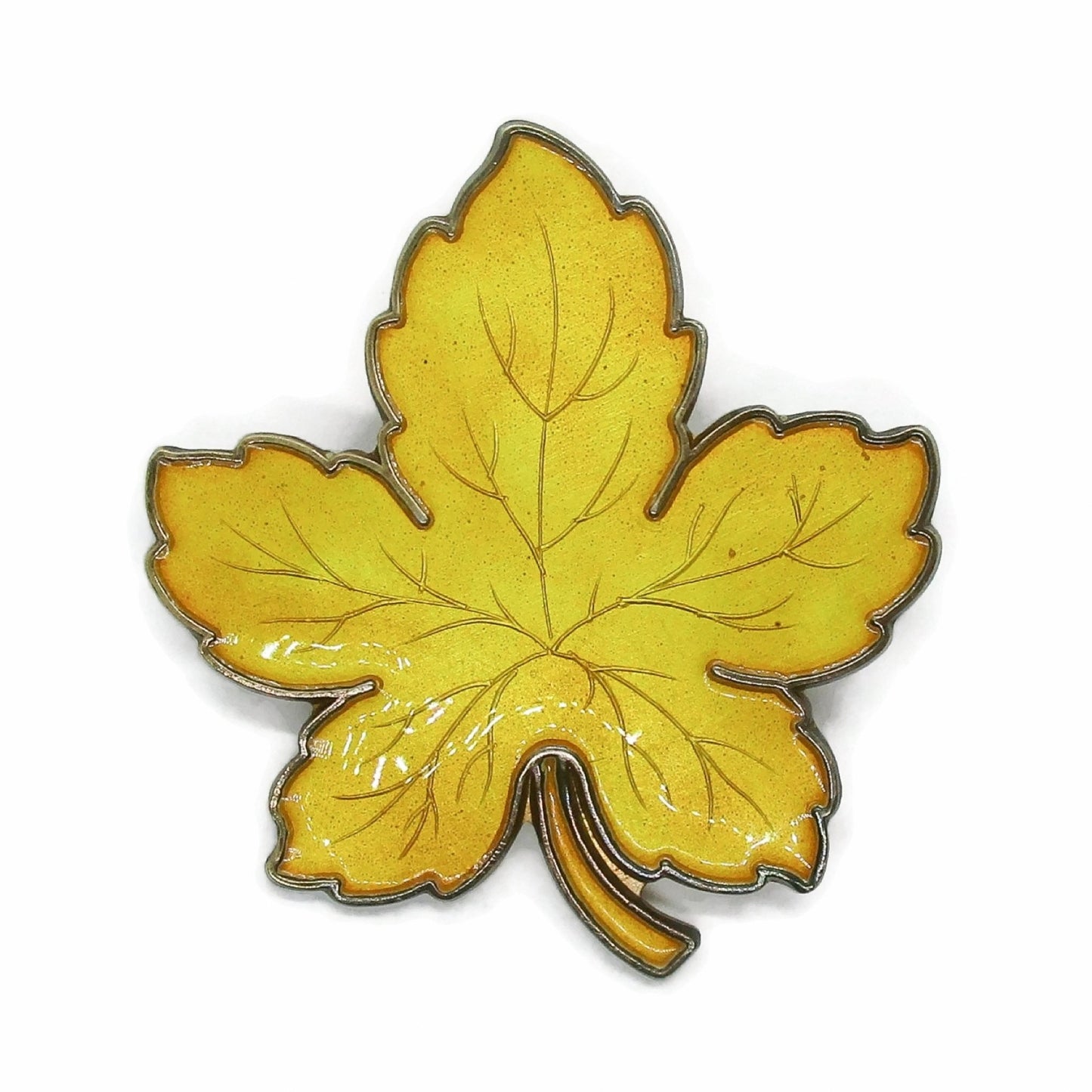 Front view of Meka Denmark sterling silver and yellow enamel maple leaf brooch