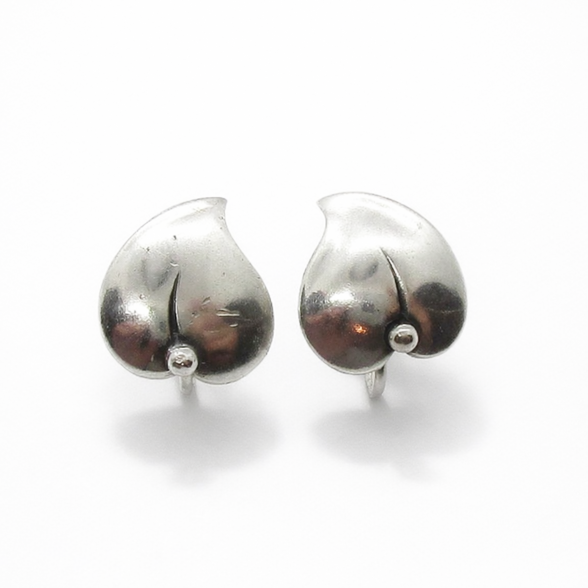 Front view of a pair of vintage sterling silver screw back leaf earring by Niels Erik From, Denmark