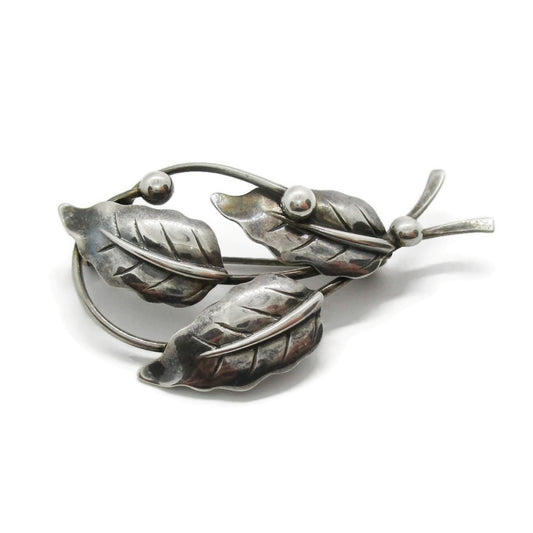 Front view of Niels Erik From Denmark sterling silver three leaf brooch