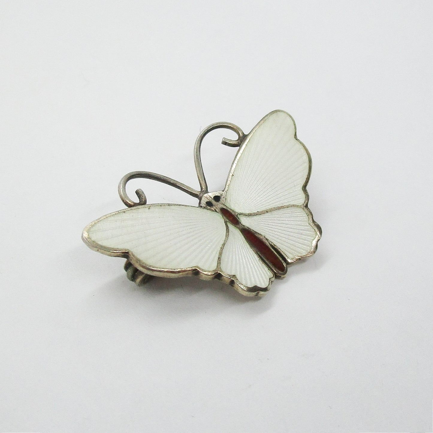 Small David Andersen sterling silver gilt and white enamel butterfly brooch close up