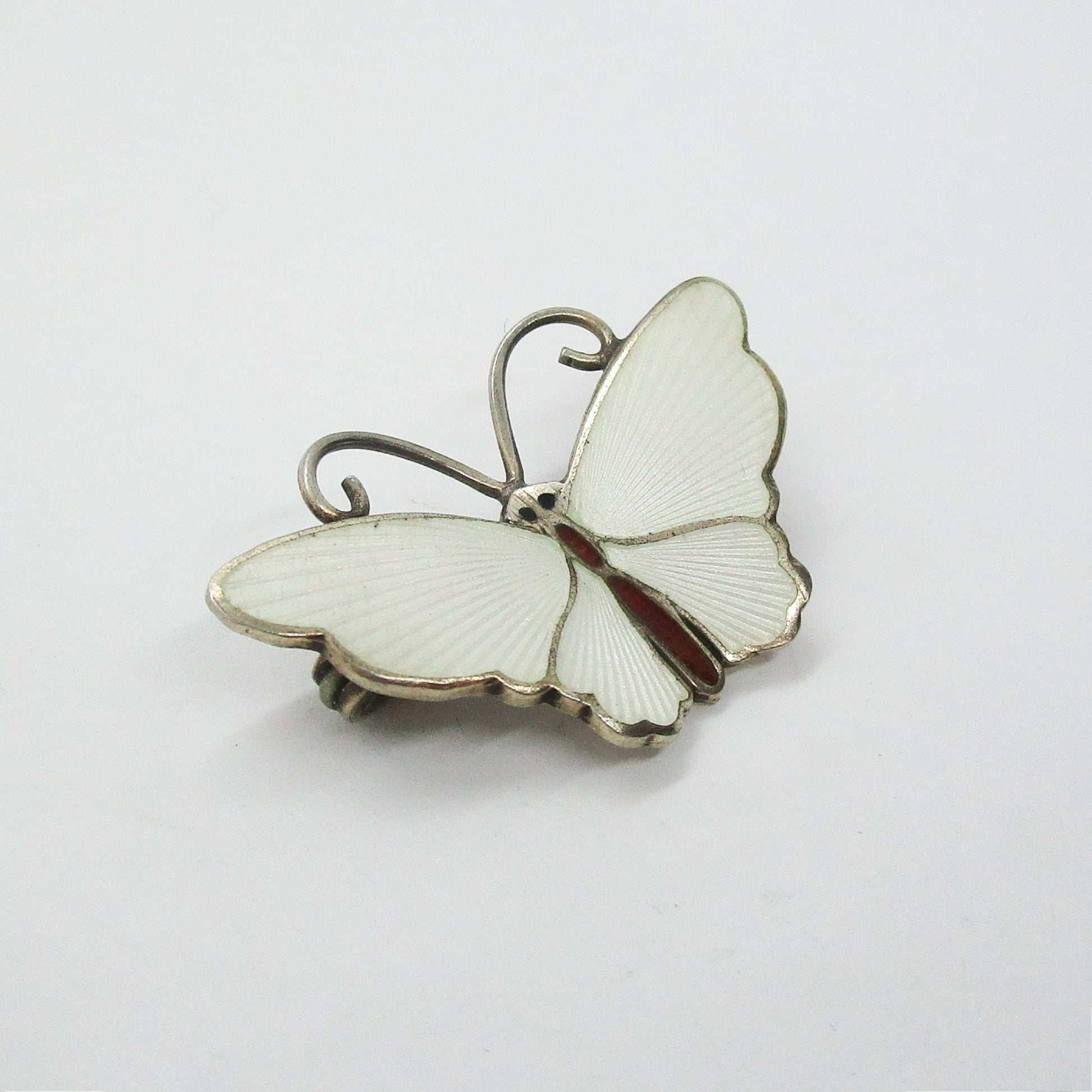 Small David Andersen sterling silver gilt and white enamel butterfly brooch close up