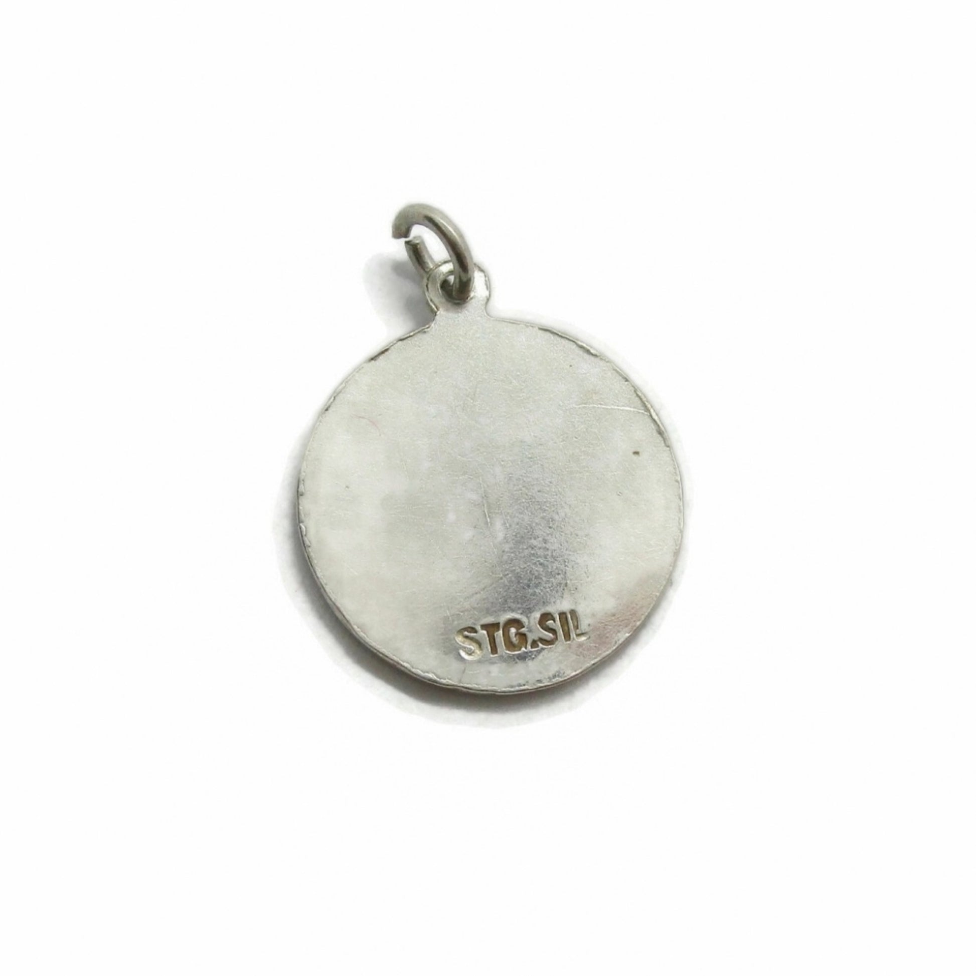 Back view of a view of a small vintage sterling silver Libra pendant showing stamp for sterling silver