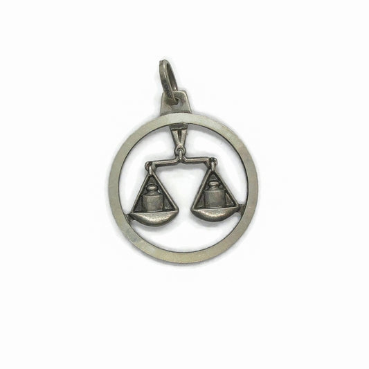 Front view of a small sterling silver Libra pendant