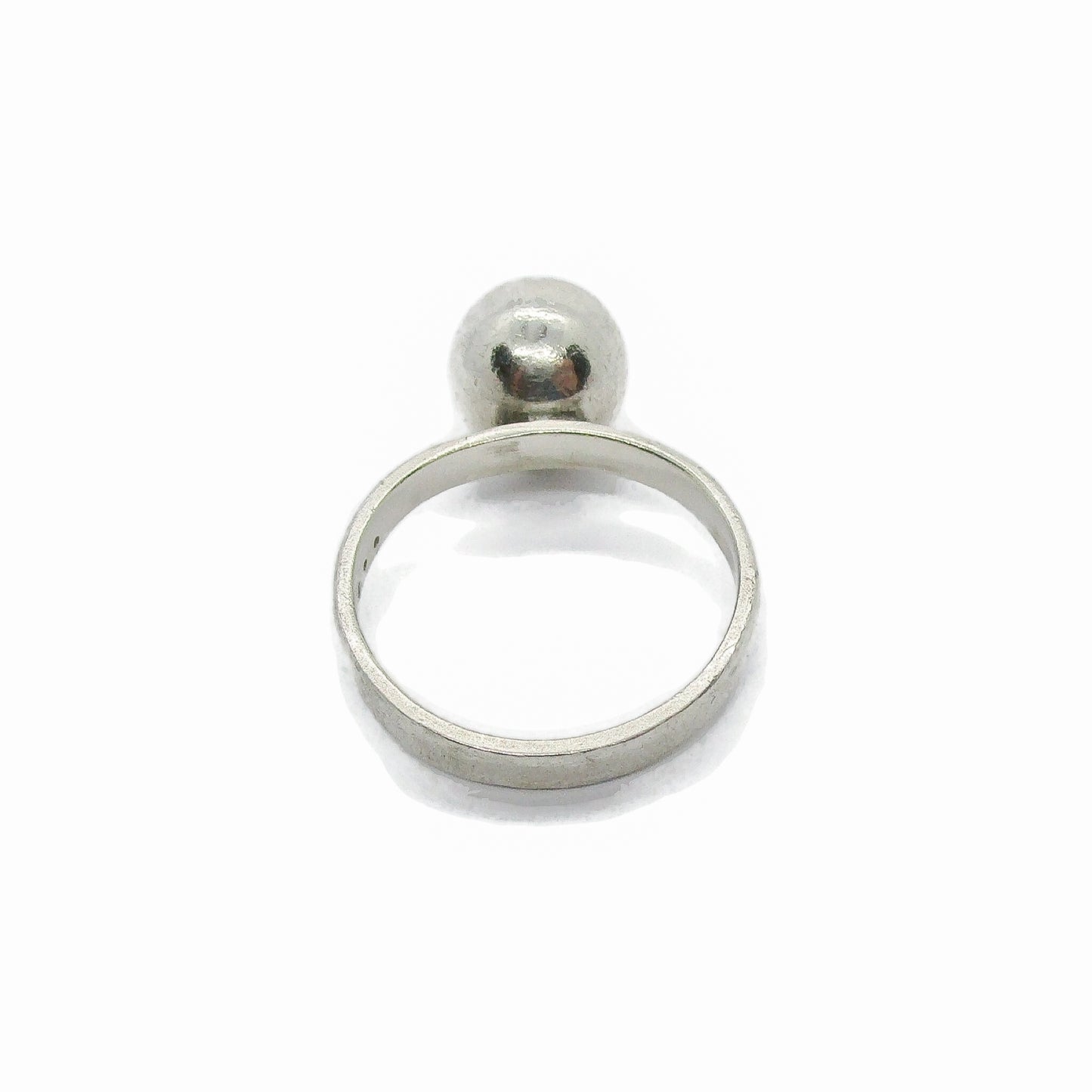 A sterling silver ball ring viewed from above