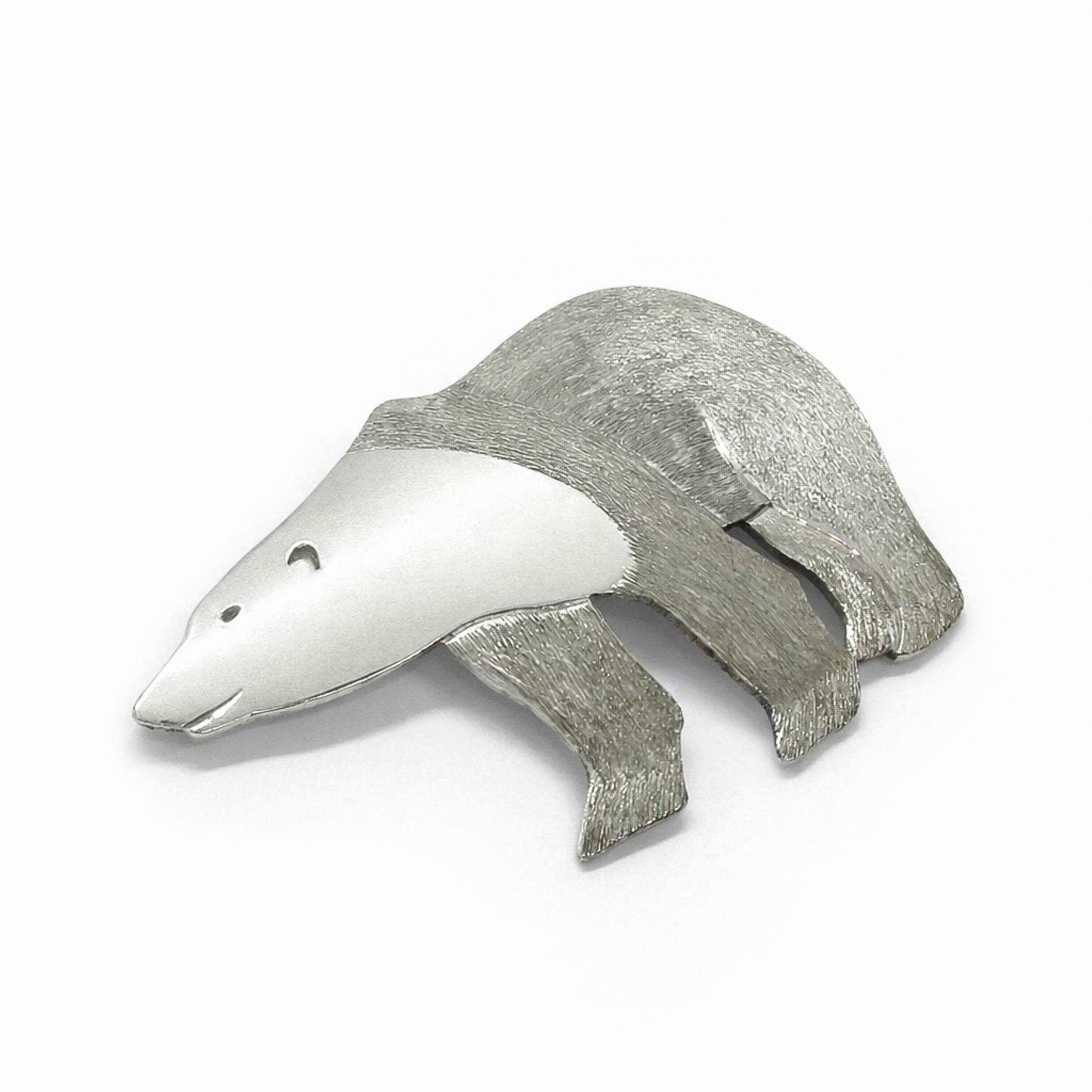 Close up view of a sterling silver polar bear brooch