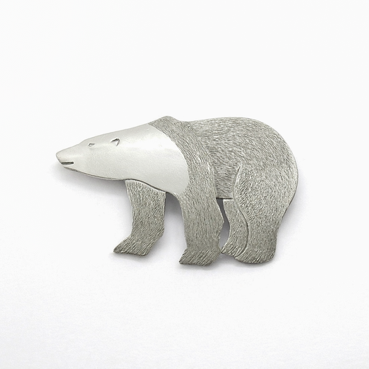 Front view of a sterling silver polar bear brooch