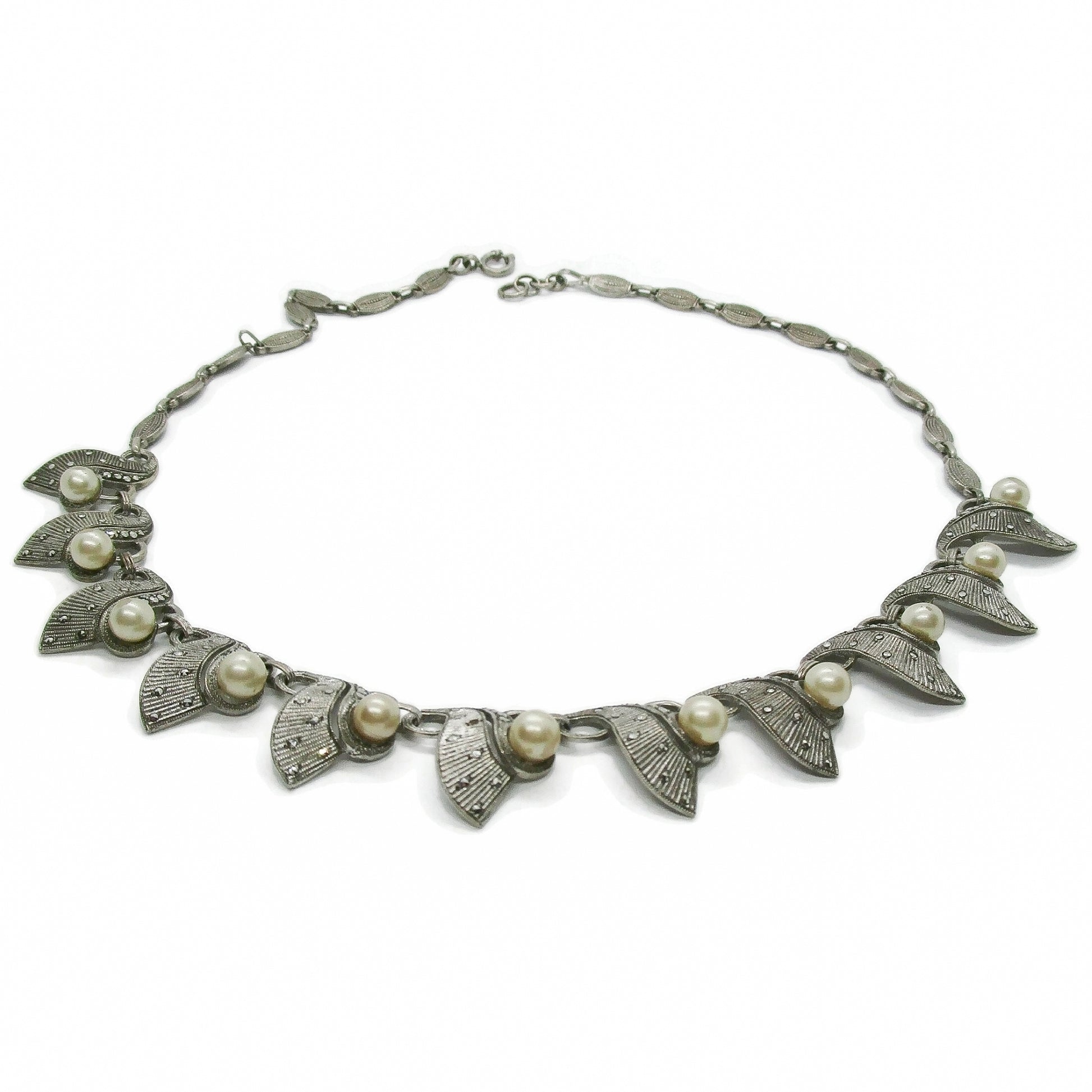 A sterling silver, marcasite and pearl necklace by Theodor Fahrner Germany on an white background