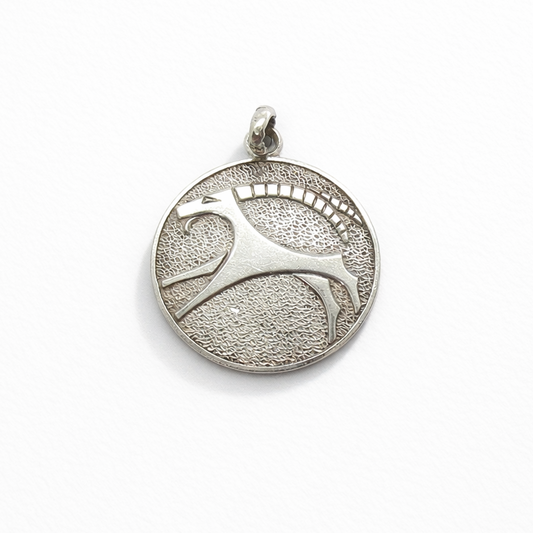 Front view of a modernist style Capricorn zodiac pendant in 835 silver