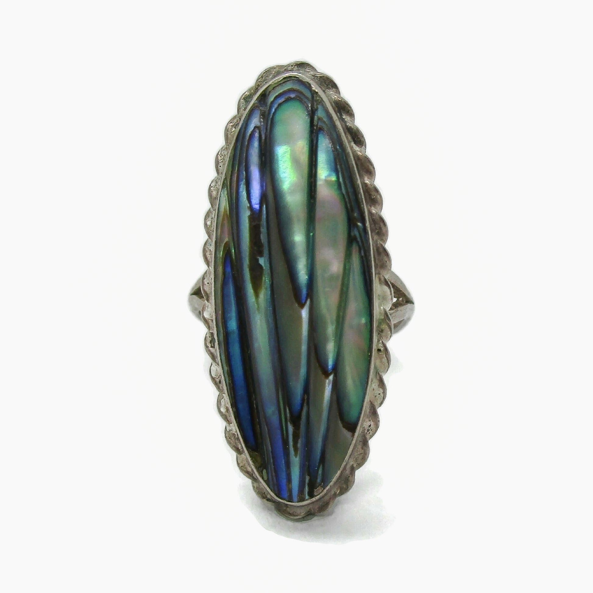 Front view of an oval sterling silver and paua shell ring by Ataahua New Zealand