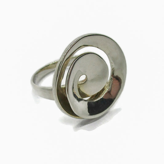 Angled view of a vintage sterling silver abstract ring in a spiral design