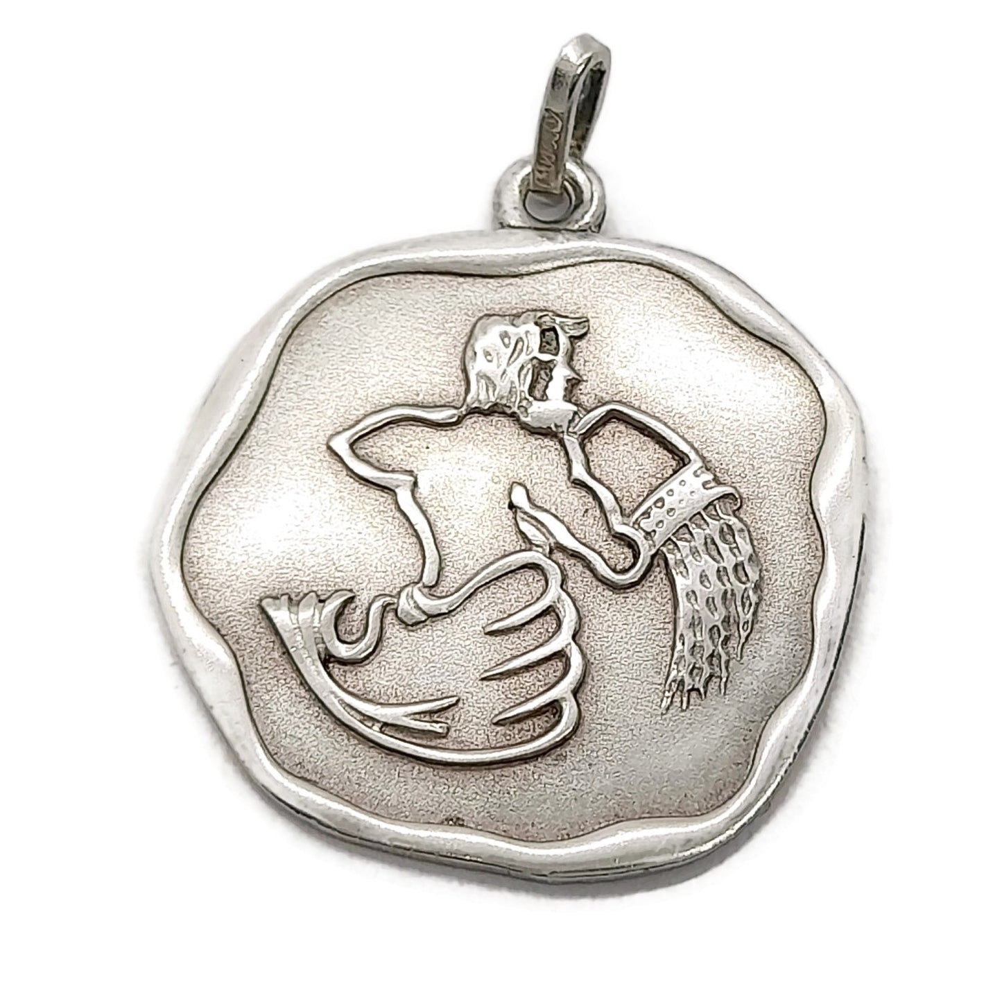 Front view of a vintage sterling silver Aquarius pendant