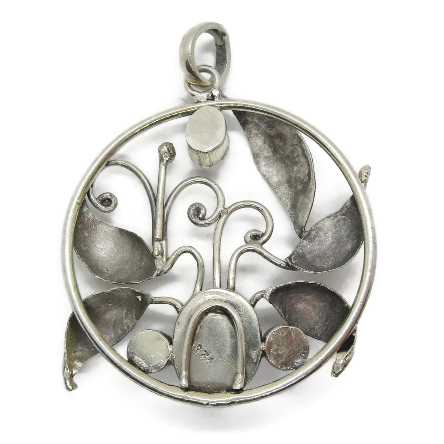 Back view of a large vintage sterling silver and gemstone floral design pendant