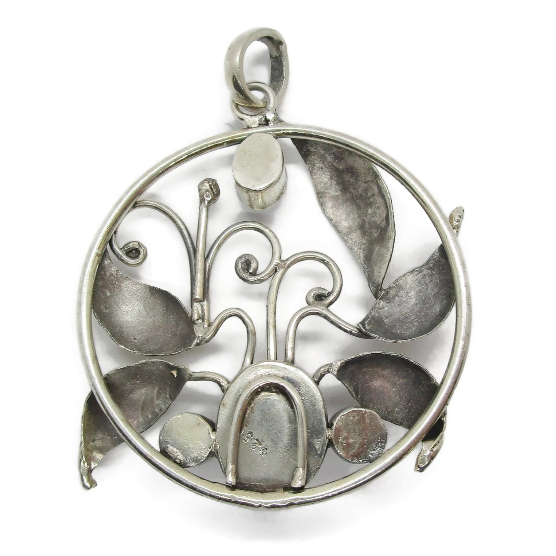 Back view of a large vintage sterling silver and gemstone floral design pendant