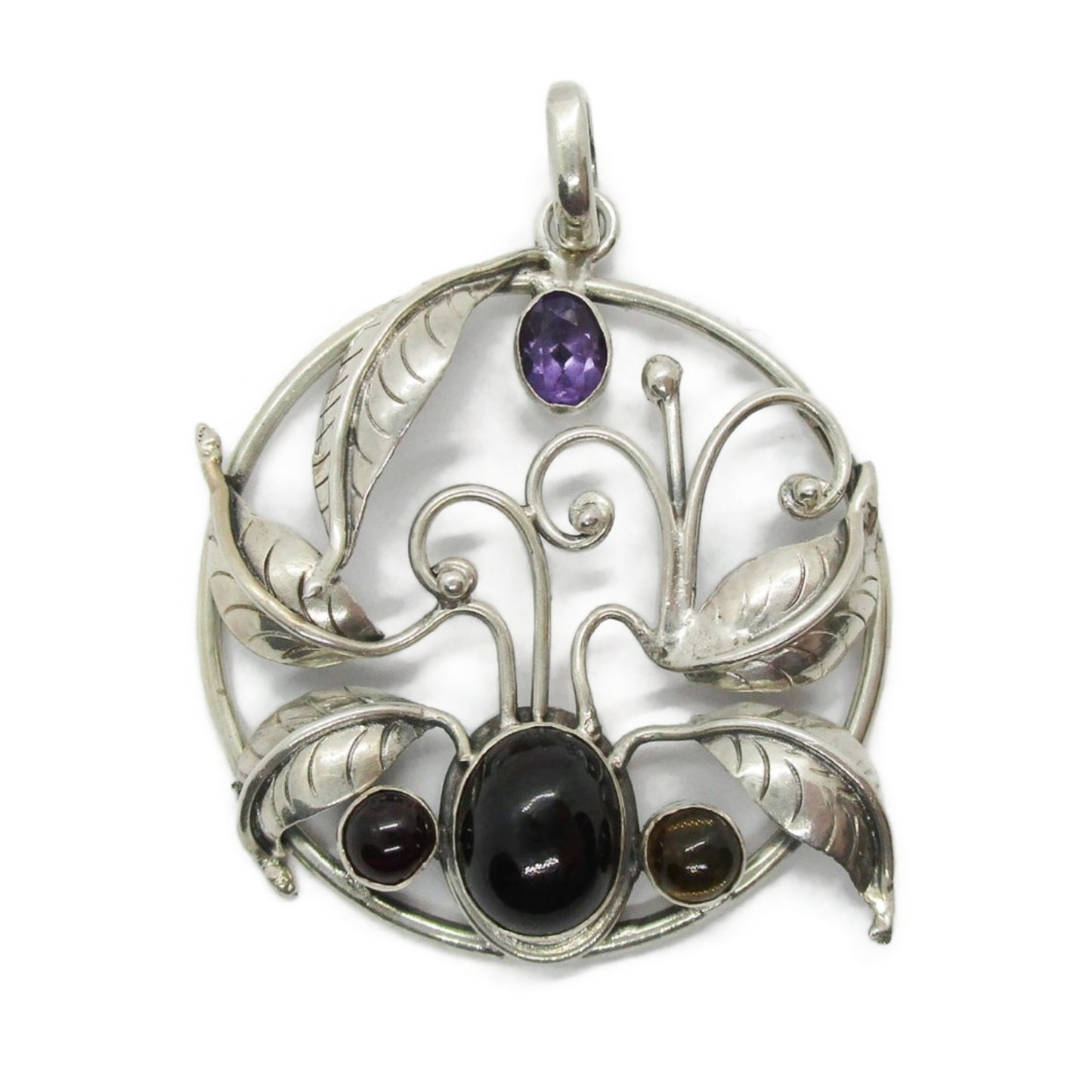 Front view of a large vintage sterling silver and gemstone floral design pendant