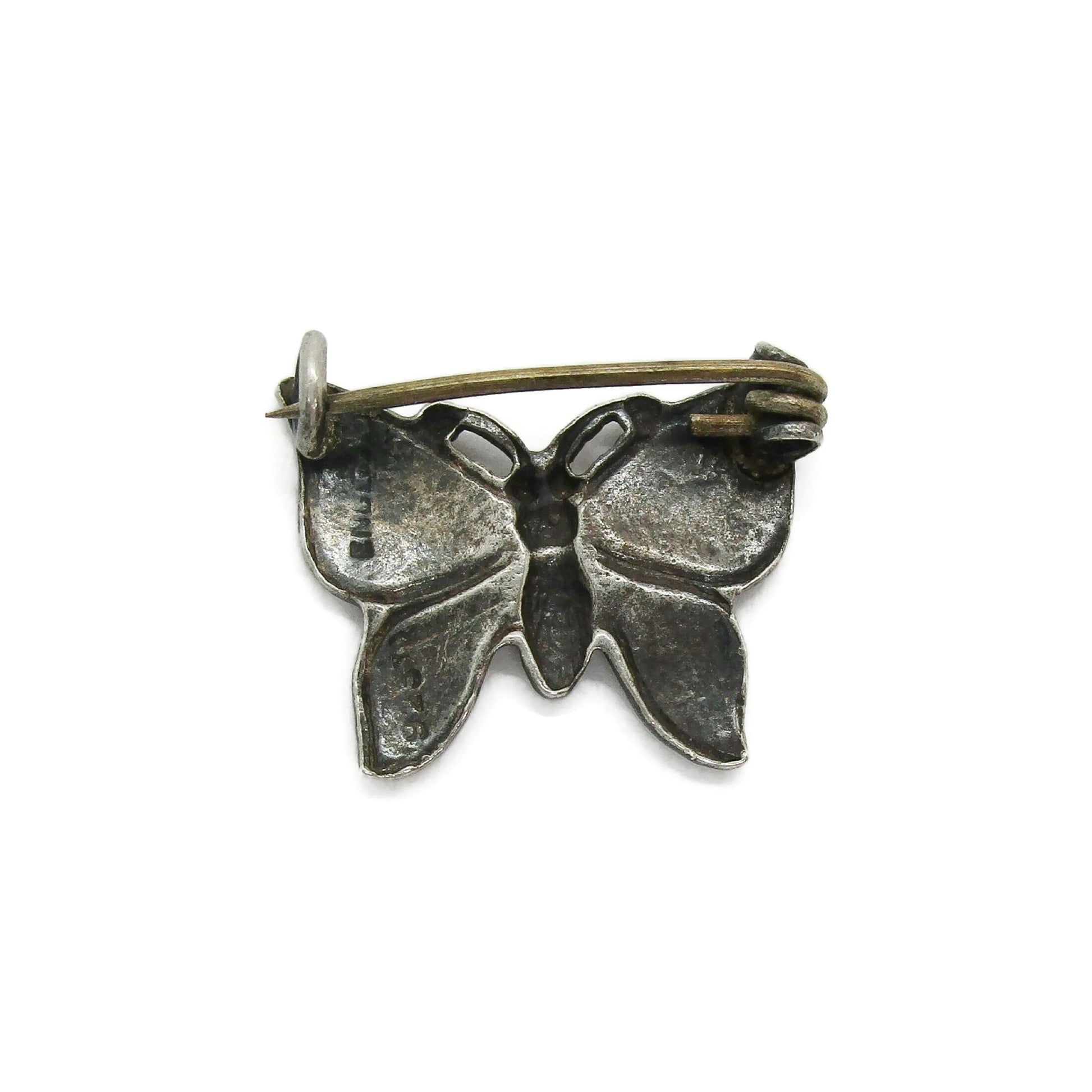 Back view of a small sterling silver butterfly brooch